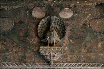 Peacock stone sculpture, architectural detail.