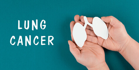Lung cancer is standing on the background, woman holds lung in her hands, smoking disease, health...