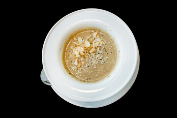 Die cut of Pumpkin Soup white sesame and almond on black isolated