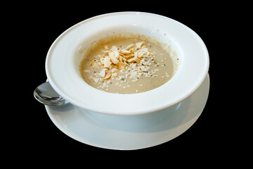 Die cut of Pumpkin Soup white sesame and almond on black isolated