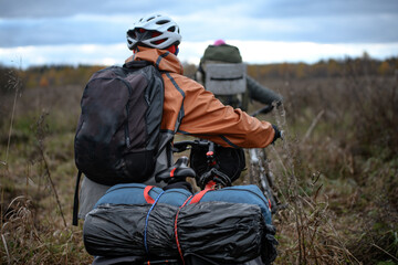 Russian bicyclists in the autumn field, Moscow Region