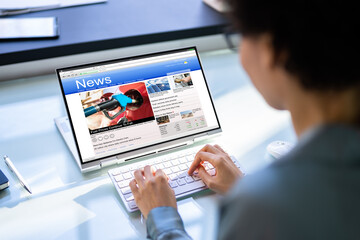 Watching News On Screen. Reading Newspaper Website