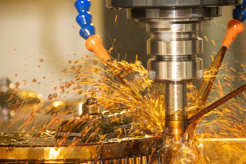 The CNC milling machine cutting the  mold parts with oil coolant method.
