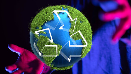 hand holding green recycle symbol