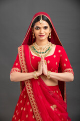 Beautiful  Indian bridal greeting in studio shot.