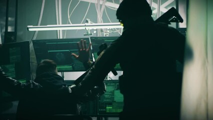 Tactical team with weapons and flashlights arresting cyber criminal using computers to hack database on dark base
