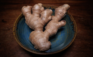 Ginger in bowl on wooden table