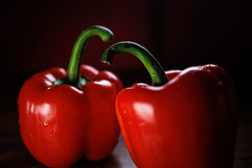 Two red pepper arranged together