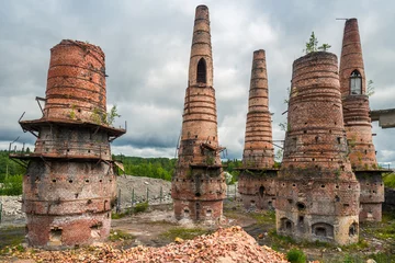 Fotobehang Old brick pipes of abandoned marble factory in Ruskeala, Karelia republic, Russia © kosmos111