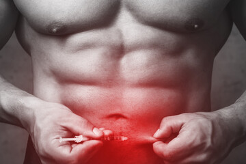 Bodybuilderprepared to make subcutaneous injection in the belly