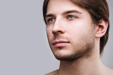 Obraz premium Young handsome man with a stubble beard