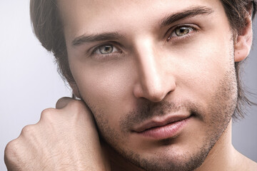 Obraz premium Young handsome man with a stubble beard