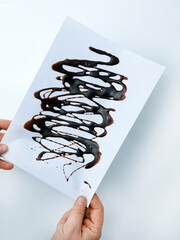 Hand holding a paper