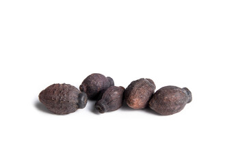 Four O'Clocks seeds, macro. Pile of small football shaped dark seeds also known as Marvel of Peru, Clavillia, Beauty of the Night or Mirabilis jalapa. Isolated on white. Selective focus.