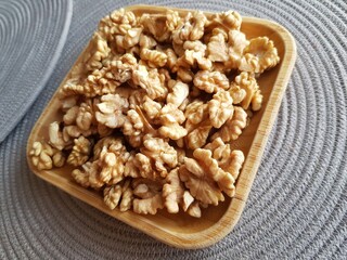 Healthy walnuts on a wooden plate