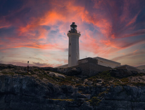 lighthouse at sunset or sunrise on the coast