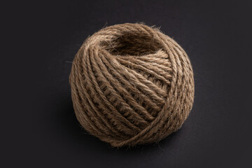 Coil of rope on dark background