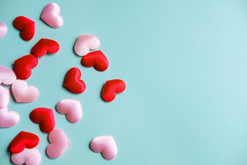 Valentine's Day background. White and red hearts on pastel blue background, top view, copy space. Valentines day concept.