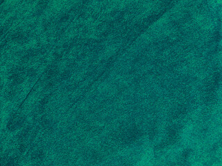 Dark green old velvet fabric texture used as background. Empty green fabric background of soft and smooth textile material. There is space for text....