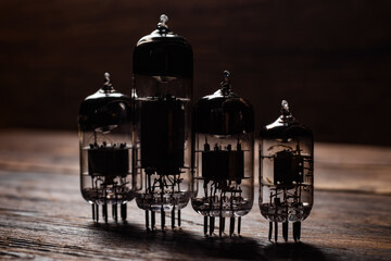 Vacuum electronic radio lamps tube standing on a wooden boards
