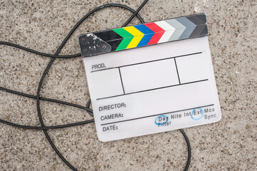 Filming on location. Empty blank clapperboard. Film process