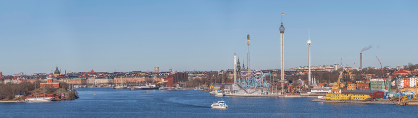 Fototapeta na wymiar Panorama harbor view, castle, amusements parks and museums around the Baltic side bays a sunny winter day in Stockholm