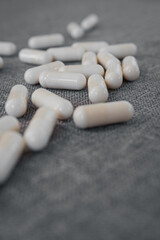 Vitamins and dietary supplements close-up. Macrophoto of capsules. Vitamins on the table.