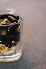 Vitamins and dietary supplements close-up. Macrophoto of capsules. Vitamins on the table.