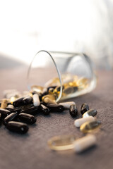 Vitamins and dietary supplements close-up. Macrophoto of capsules. Vitamins on the table.