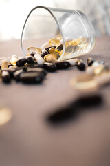 Vitamins and dietary supplements close-up. Macrophoto of capsules. Vitamins on the table.