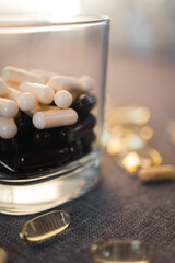 Vitamins and dietary supplements close-up. Macrophoto of capsules. Vitamins on the table.
