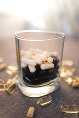 Vitamins and dietary supplements close-up. Macrophoto of capsules. Vitamins on the table.