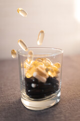 Vitamins and dietary supplements close-up. Macrophoto of capsules. Vitamins on the table.
