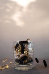 Vitamins and dietary supplements close-up. Macrophoto of capsules. Vitamins on the table.