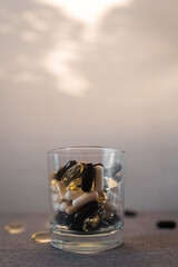 Vitamins and dietary supplements close-up. Macrophoto of capsules. Vitamins on the table.