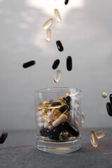 Vitamins and dietary supplements close-up. Macrophoto of capsules. Vitamins on the table.