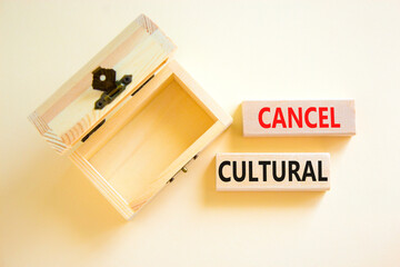 Cancel cultural symbol. Concept words Cancel cultural on wooden blocks on a beautiful white table white background. Empthy wooden chest. Business and cancel cultural concept, copy space.