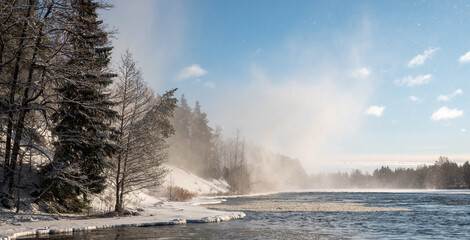 Winter river landscape in frosty weather