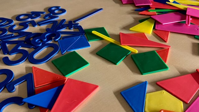 Plastic numbers and figures for the development of the child's intelligence, simple operations with numbers for education in childhood
