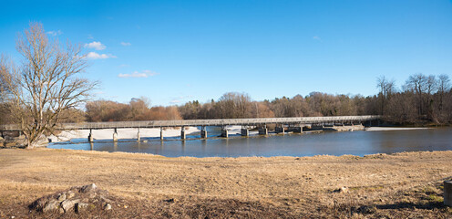 Fototapeta premium wooden bridge Flauchersteg across Isar river, recreational area Thalkirchen, munich