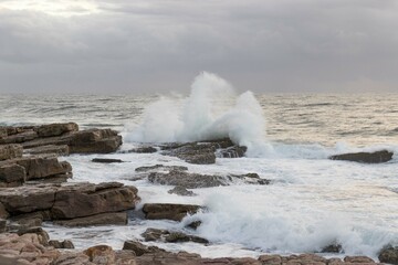 Waves crashing onto rocks on the south coast of South Africa