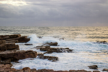 Waves crashing onto rocks on the south coast of South Africa