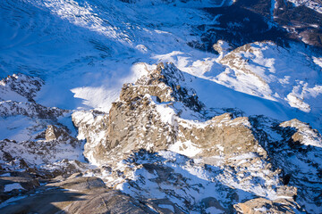 The rocks in the mountains of the Mont Blanc Massif in Europe, France, Rhone Alpes, Savoie, Alps, in winter on a sunny day.