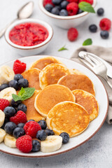 Keto diet pancakes made of almond flour, served with berries.