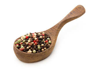 Pepper mix seed on spoon on white background.