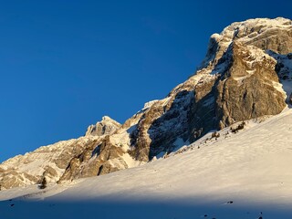 Idyllic steep alpine rocky peaks of the Swiss Alpstein massif dressed in icy pure white snow cover - Canton of Appenzell Ausserrhoden, Switzerland (Schweiz)