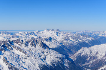 Chamonix Valley surrounded by mountains in Europe, France, Rhone Alpes, Savoie, Alps, in winter on a sunny day.