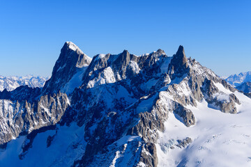 Fototapeta na wymiar Grandes Jorasses, Dent and Glacier du Geant, Aiguilles Marbrees in Europe, France, Rhone Alpes, Savoie, Alps in winter on a sunny day.