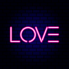 Neon word Love on brick wall background.
