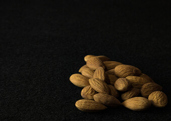 almonds on black background 